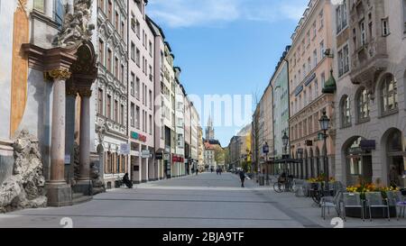 Empty pedestrian zone in the city center (Sendlinger Straße). Historical buildings on the left and right. During Coronavirus (Covid-19) lockdown. Stock Photo