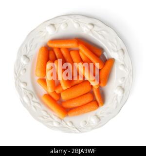 Small baby carrots in plate on white background Stock Photo