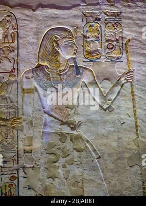 Ancient paintings and Egyptian hieroglyphs at the pharaoh tomb in the Valley of the Kings in Luxor, Egypt Stock Photo