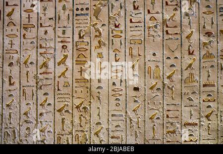 Ancient paintings and Egyptian hieroglyphs at the pharaoh tomb in the Valley of the Kings in Luxor, Egypt Stock Photo