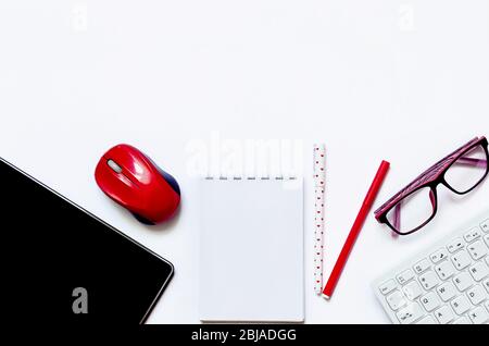 glasses, notepad, keyboard and mouse, Tablet, headphones, notebook, school supplies on white background. Online education concept. Distance school in Stock Photo