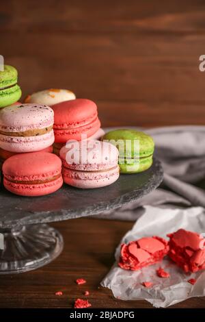 Tasty colorful macaroons on glass stand Stock Photo