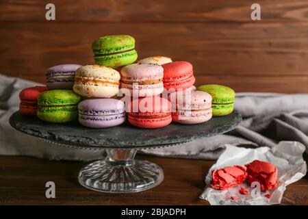 Tasty colorful macaroons on glass stand Stock Photo