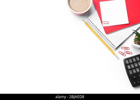 Cup of coffee with office tools on white background Stock Photo