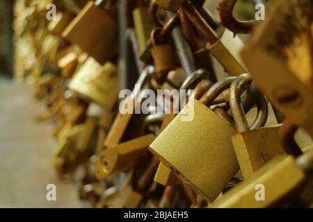 Closeup Gold Love Locks on the Railing of the Bridge of Lovers in Old Tbilisi, Georgia Stock Photo