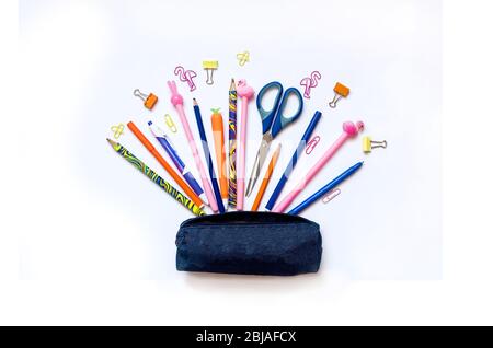 Various school stationery with a blue pencil case on white background. Education or Back to school concept. Top view. Copy space Stock Photo