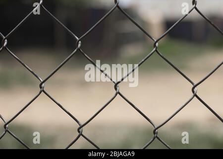 Blur grey steel fence background beautiful line with iron of thorn texture metal net no people and nice design Stock Photo