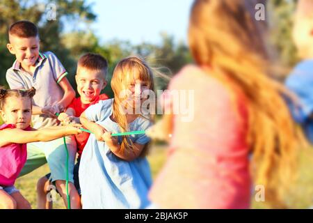 Happy kids playing in park Stock Photo