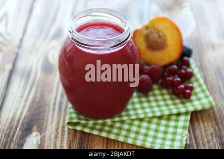 Fresh fruit and berry cocktail on wooden background Stock Photo
