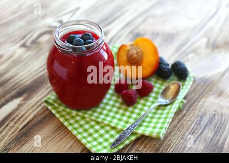 Fresh fruit and berry cocktail on wooden background Stock Photo