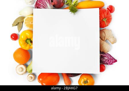 Vegetables and sheet of paper on white background Stock Photo