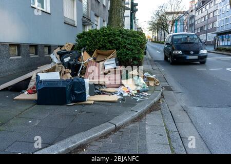 Illegally disposed garbage, on a sidewalk, no bulky waste, on Bismarckstrasse in Essen, Germany Stock Photo