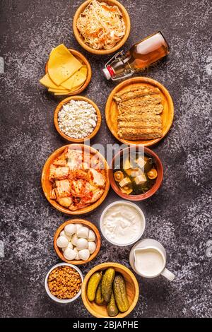 Fermented food, probiotics - kefir, kombucha, sauerkraut, pickles, miso soup, tempeh, natto, kimchi, yogurt, mozzarella and gouda cheeses, cottage che Stock Photo