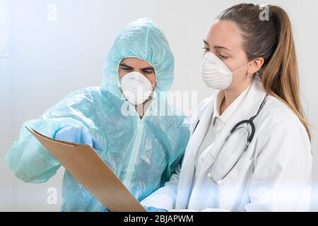 Coronavirus. Portrait of doctors and nurses working in the hospitals and fighting the coronavirus. Doctors are heroes. Doctors in the protective suits Stock Photo