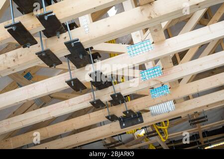 Wooden roof joists ready to be installed on a building site. Stock Photo