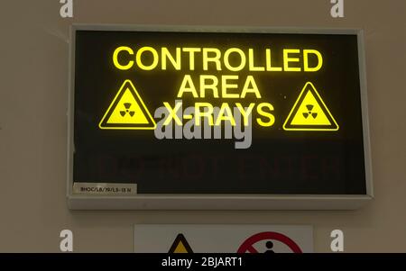 Sign outside an X-Ray room in a hospital in the UK. Stock Photo