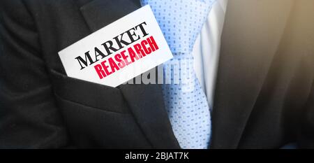 Market research text on card in the pocket of businessman. Know your customer Business Concept Stock Photo