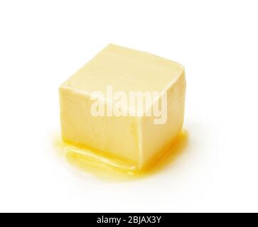 A piece of melting butter isolated on white background. Butter cube. Stock Photo