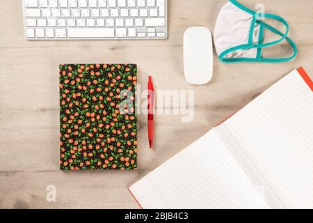 Nurse wooden desk ready for the day schedule. Keyboard diary and notebook on a wooden background Stock Photo