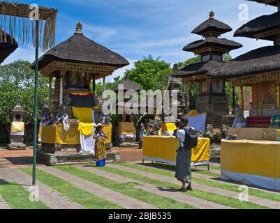 dh Balinese Batuan temple BALI INDONESIA Hindu temples tourists photo traditional dress code hinduism inner sanctum tourist photographing Stock Photo