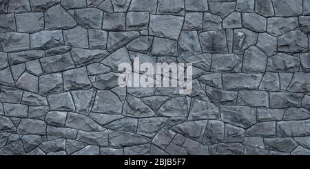 Abstract stone texture, grunge pattern. Gray blank concrete wall, natural brick background, wallpaper of architecture facade. Wide panorama Stock Photo