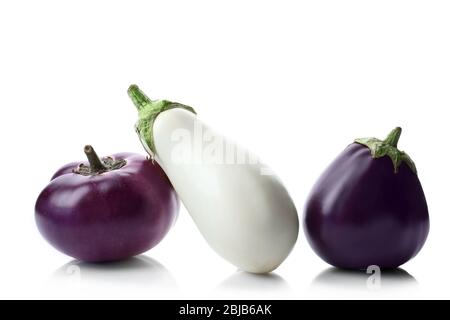 Fresh eggplants in a row isolated on white Stock Photo