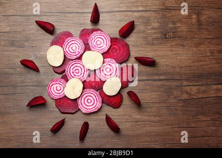 Sliced beetroot on wooden background, top view Stock Photo