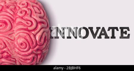 Innovate word next to a human brain model Stock Photo