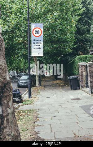 London/UK-30/7/18: Billboard on a pillar showing twenty miles per hour speed limit sign and the inscription 'Slower speeds, safer streets' on it insti Stock Photo