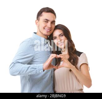Beautiful couple making heart shape with hands on white background Stock Photo