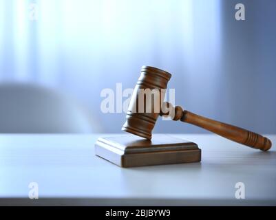 Judges gavel on table in the room Stock Photo