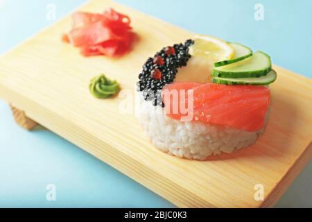 Sushi doughnut on wooden stand Stock Photo