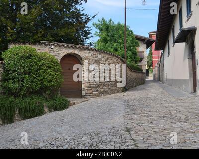 Empty narrowl cobblestone street in Bergamo Italy Stock Photo