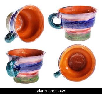 set from handmade and handpainted cups from red clay isolated on white background Stock Photo
