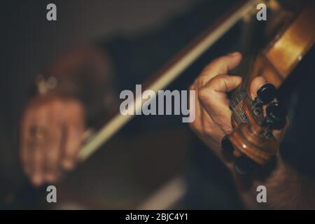 Man playing violin at wedding Stock Photo