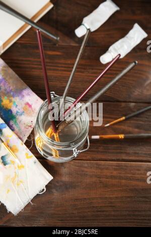 Brushes in a jar with water Stock Photo