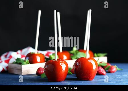 Candy apples with strawberry on dark background Stock Photo
