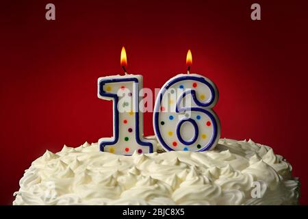 Birthday cake with candles on color background Stock Photo