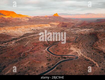 Route 66 winding through the Black Mountains of Arizona, descending from Oatman toward Kingman at sunset Stock Photo