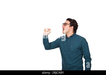 Side view angry businessman speaks loud, as holding an invisible imaginary megaphone or microphone in his hand isolated on white background with copy Stock Photo