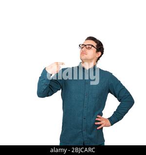 Portrait of contented and arrogant businessman, proud of himself, points index finger to him, cocksure gesture, isolated on white background. Confiden Stock Photo