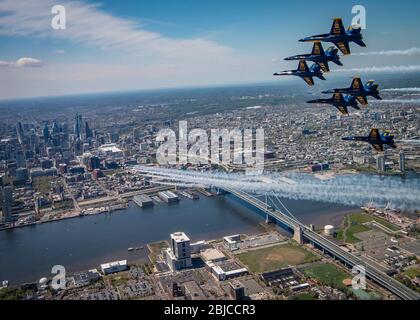 Philadelphia, United States. 28th Apr, 2020. The U.S. Air Force Air Demonstration Squadron, the Thunderbirds, lower, and the Navy Demonstration Squadron, the Blue Angels, top, fly over Camden and Philadelphia during the America Strong flyover April 28, 2020 in Philadelphia, Pennsylvania. America Strong is a salute from the Navy and Air Force to recognize healthcare workers, first responders, and other essential personnel in a show of national solidarity during the COVID-19 pandemic. Credit: Cory Bush/U.S. Air Force/Alamy Live News Stock Photo