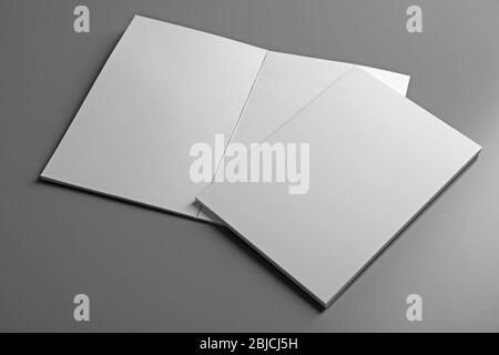 Blank notebooks on grey background Stock Photo