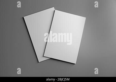 Blank notebooks on grey background Stock Photo