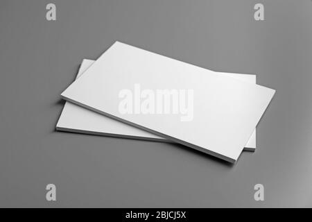 Blank notebooks on grey background Stock Photo