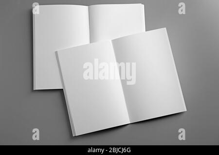 Blank open brochures on grey background Stock Photo