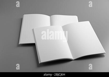 Blank open brochures on grey background Stock Photo