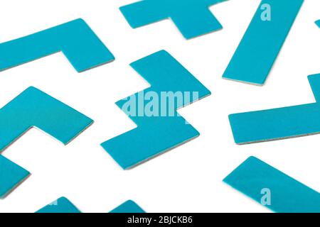 Various shapes, blue puzzle elements, pattern, white background abstract. Scattered unorganized parts, simple different unlinked disconnected figures Stock Photo