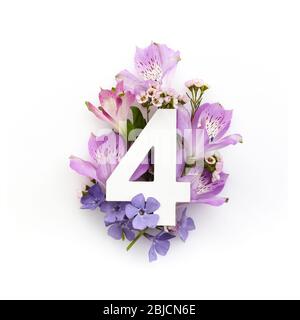 Creative layout with colourful flowers and number for. Flat lay. Top view. Stock Photo