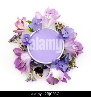 Frame made with various colorful flowers on white background with copyspace for text. Tlat lay. Top view Stock Photo